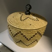 Cover image of Lidded Basket with Stone Woman's Head Handle
